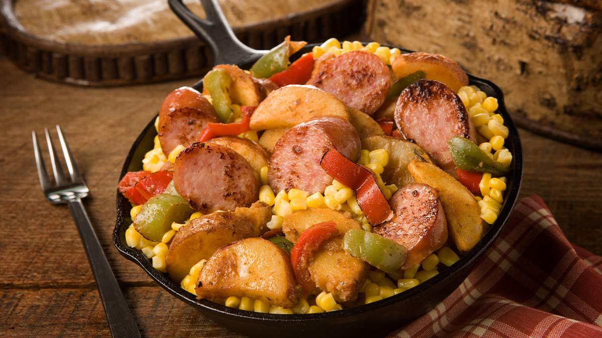 Close up of skillet meal on wooden table with fork at Silver Dollar City in Branson, Missouri, USA